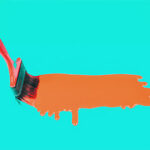 Paintbrush creating an orange paint streak on a teal background